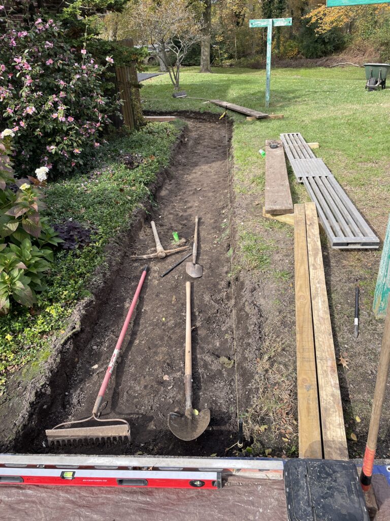 Sidewalk path excavated by hand